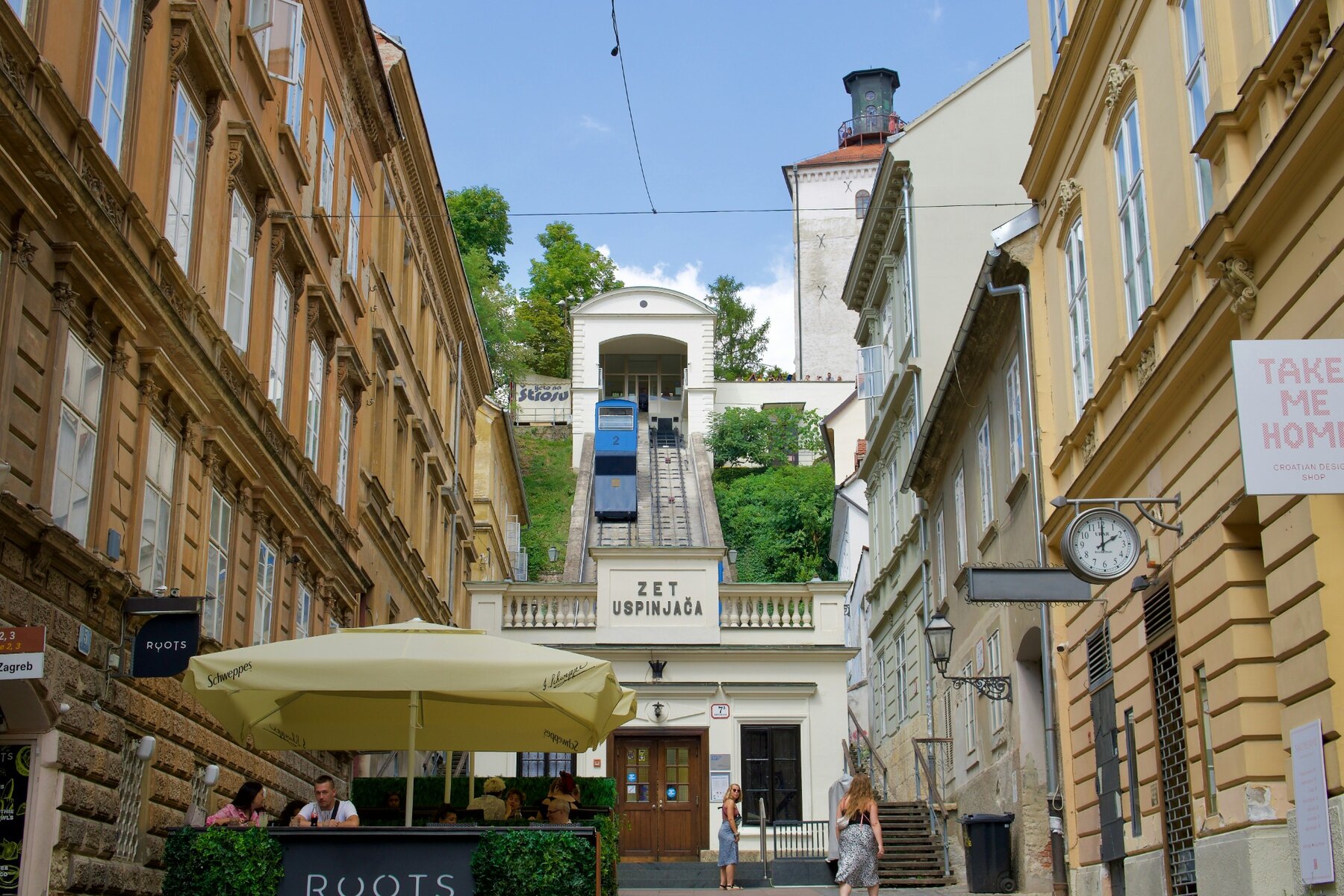 People and café tables near the Upper Town funicular in Zagreb