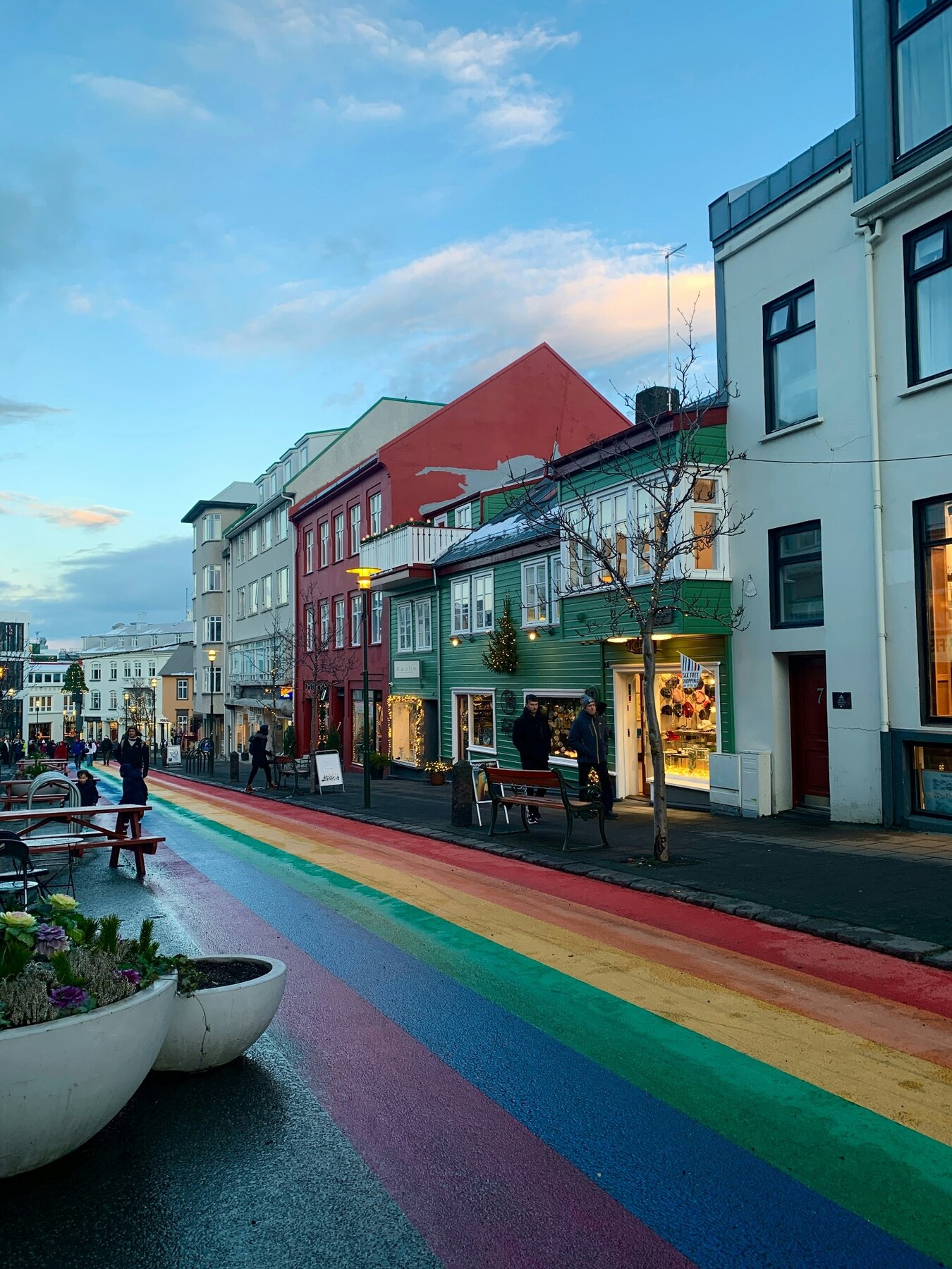 A Reykjavík street with low colourful houses and Hallgrímskirkja beyond