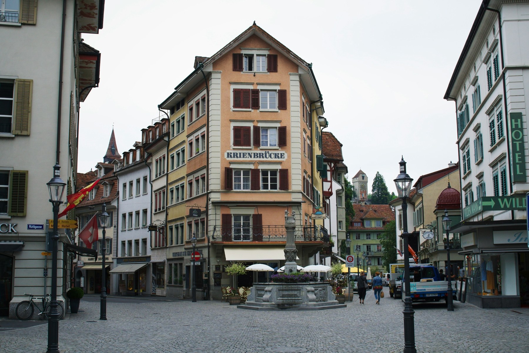 A historic square with painted façades in Lucerne's old town.