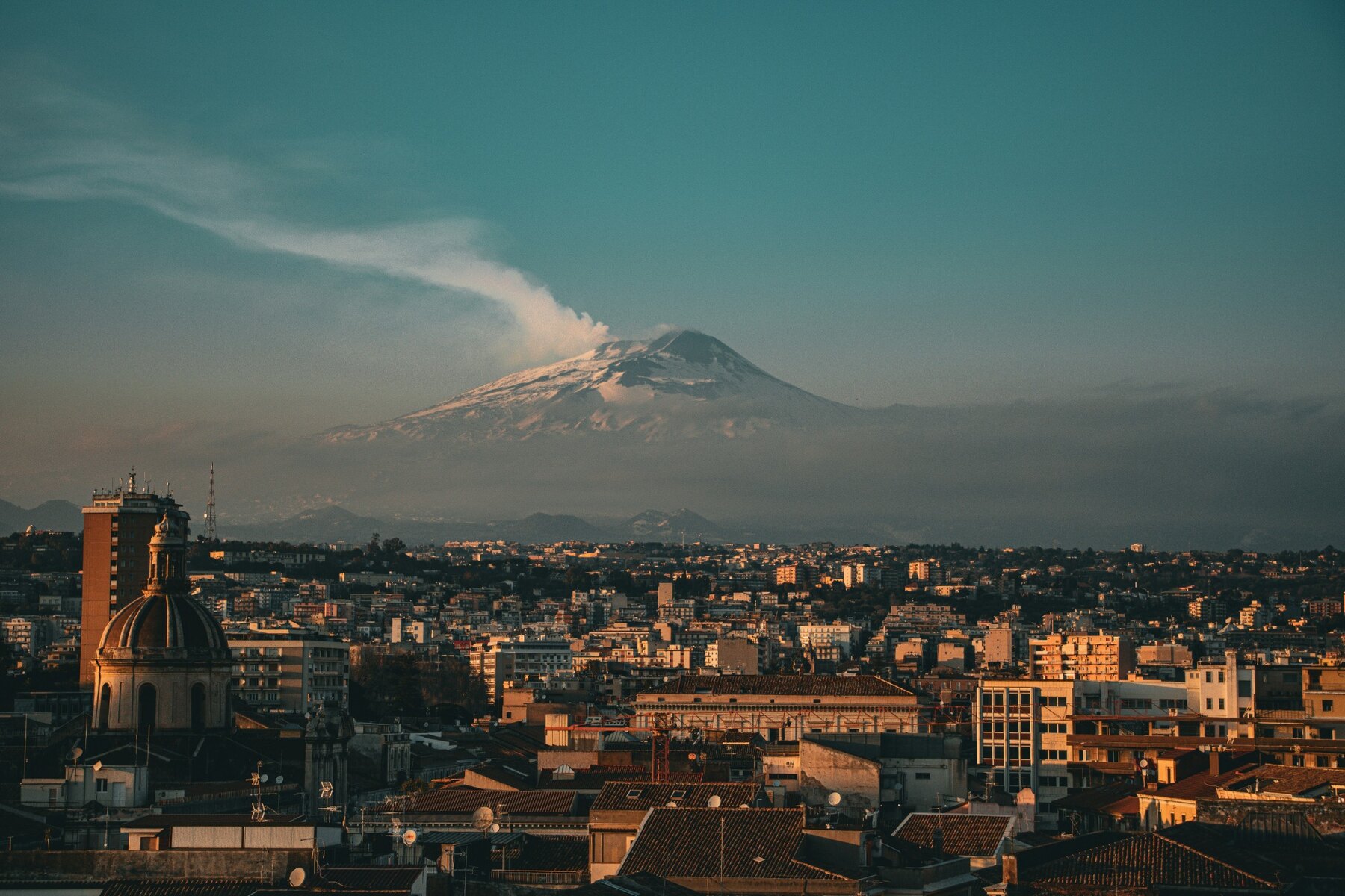 Catania spread beneath the snow-capped summit of Mount Etna