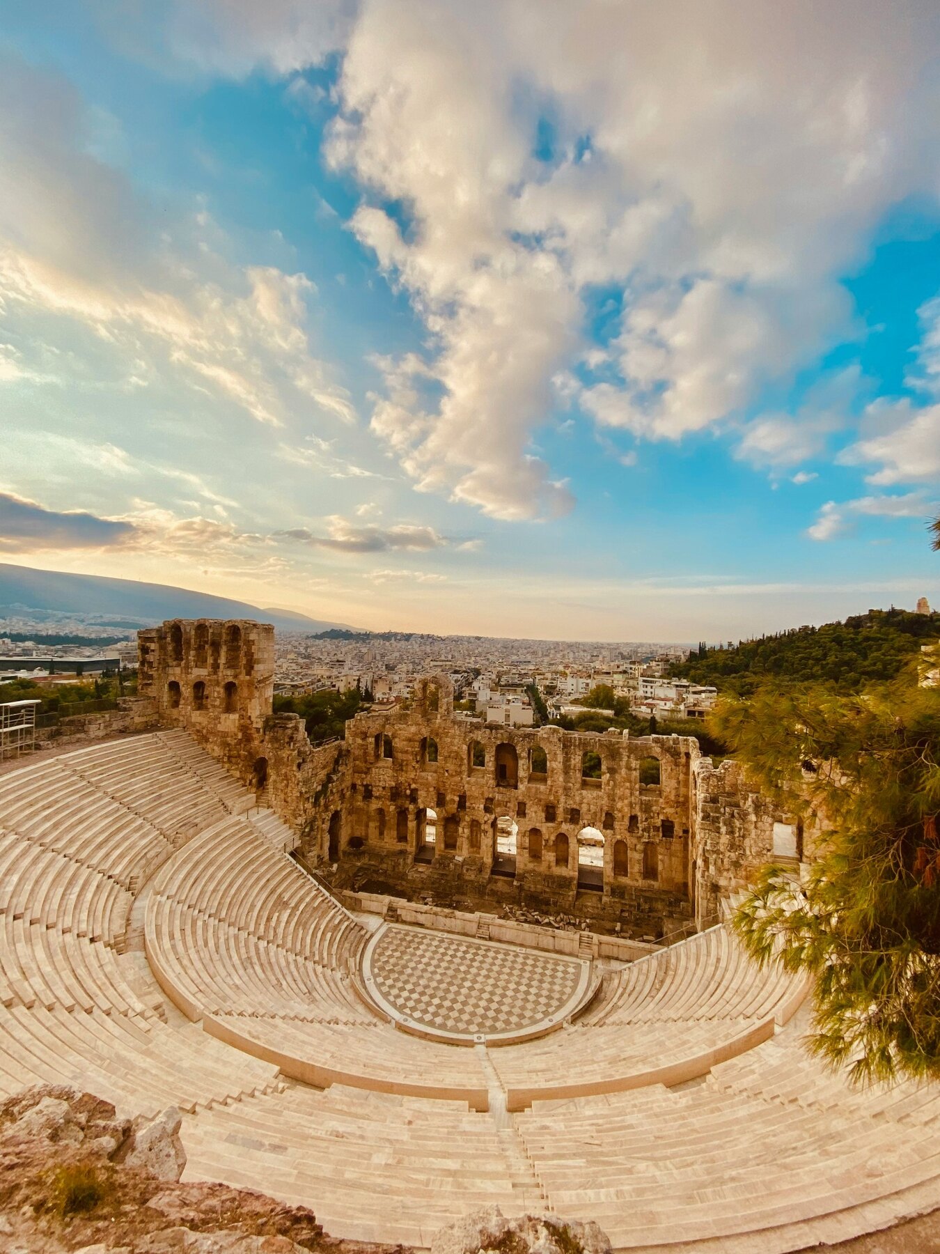 The ancient theatre of Herodes Atticus beneath an evening sky in Athens