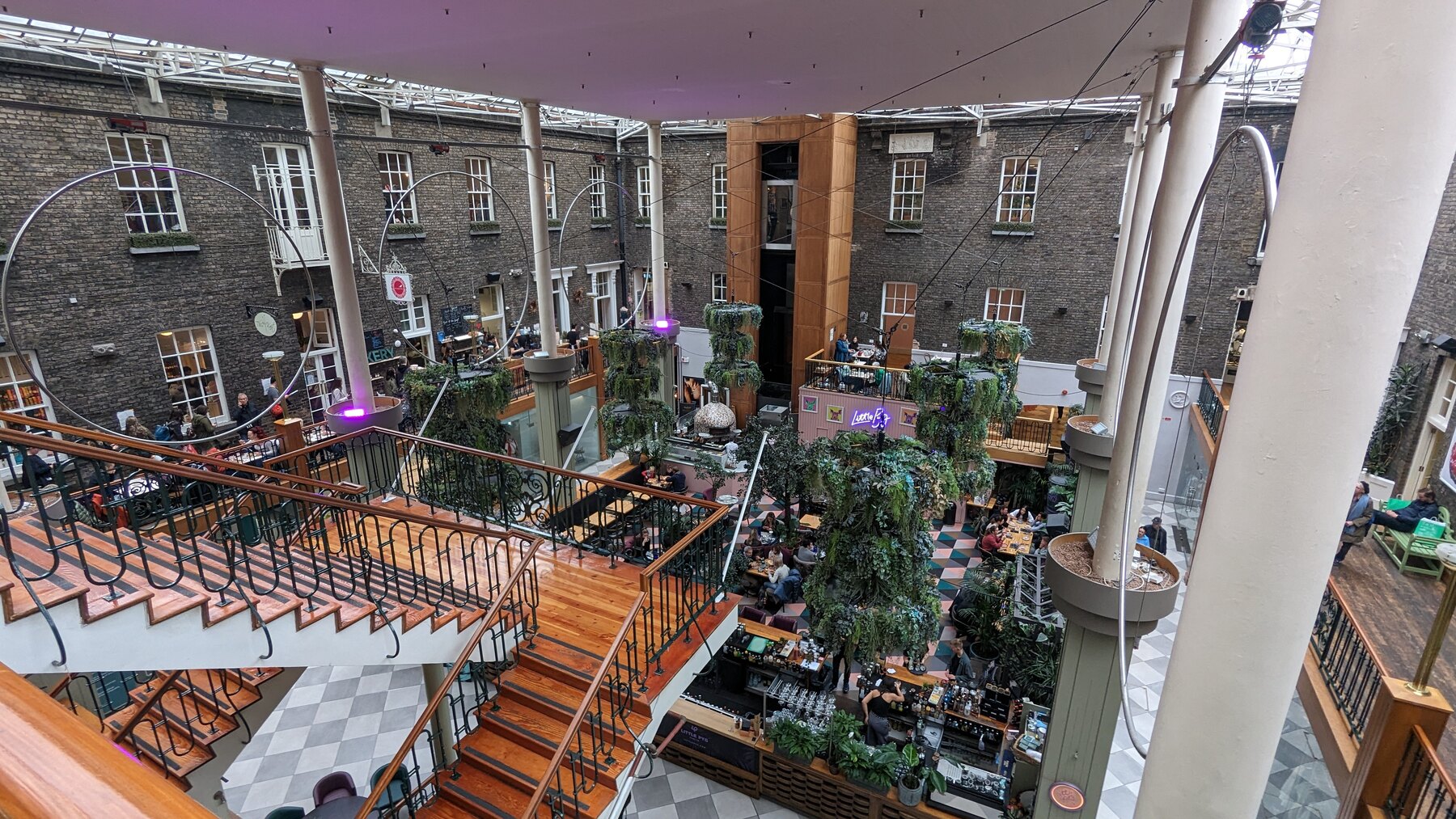 The planted courtyard and brick buildings of a Dublin cultural complex