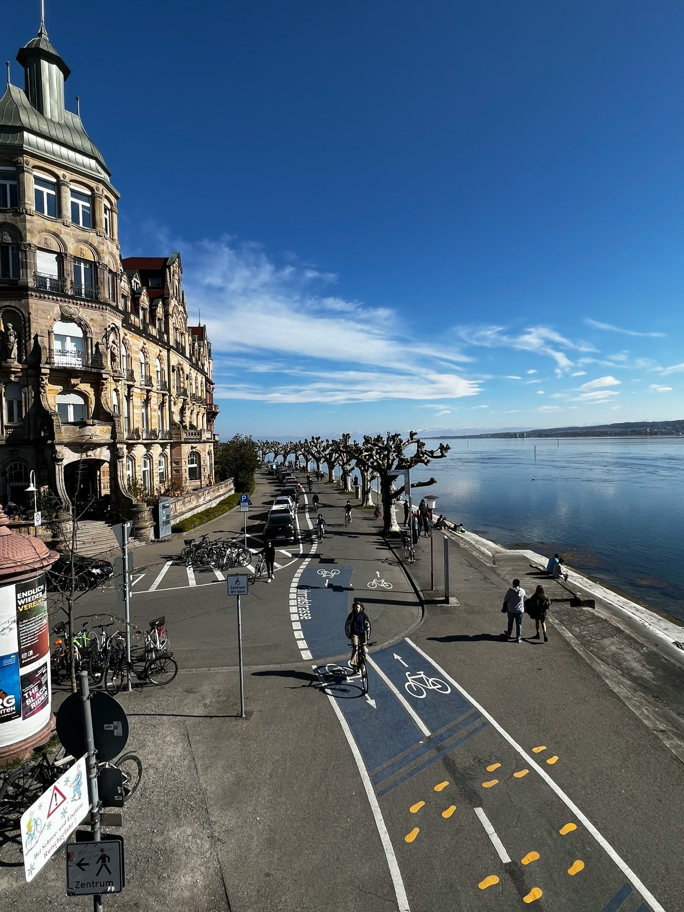 Cyclists following the lakeside route beside Lake Constance.