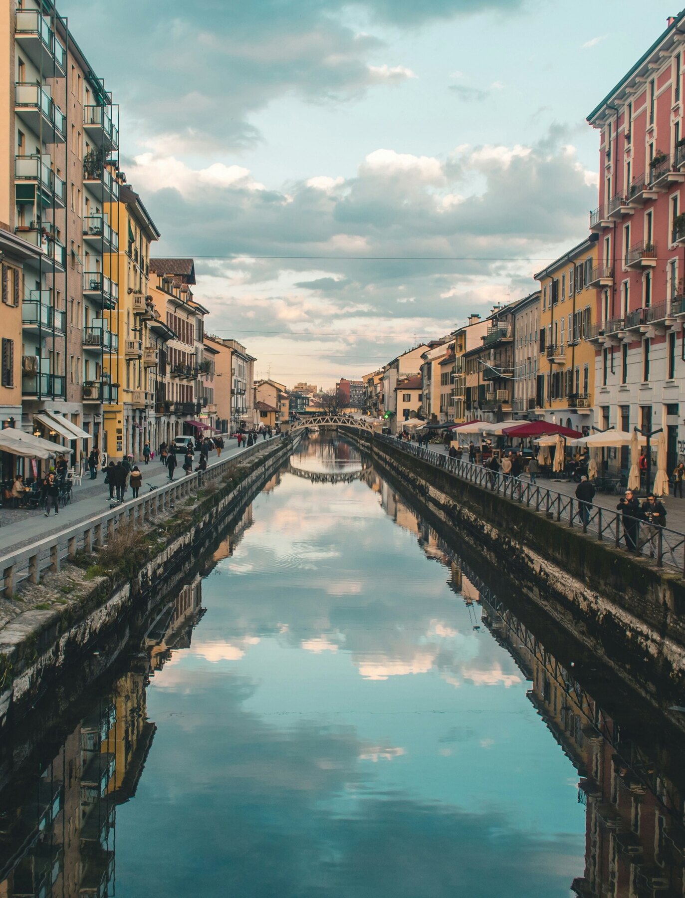 The Navigli canal lined by buildings and reflected in still water