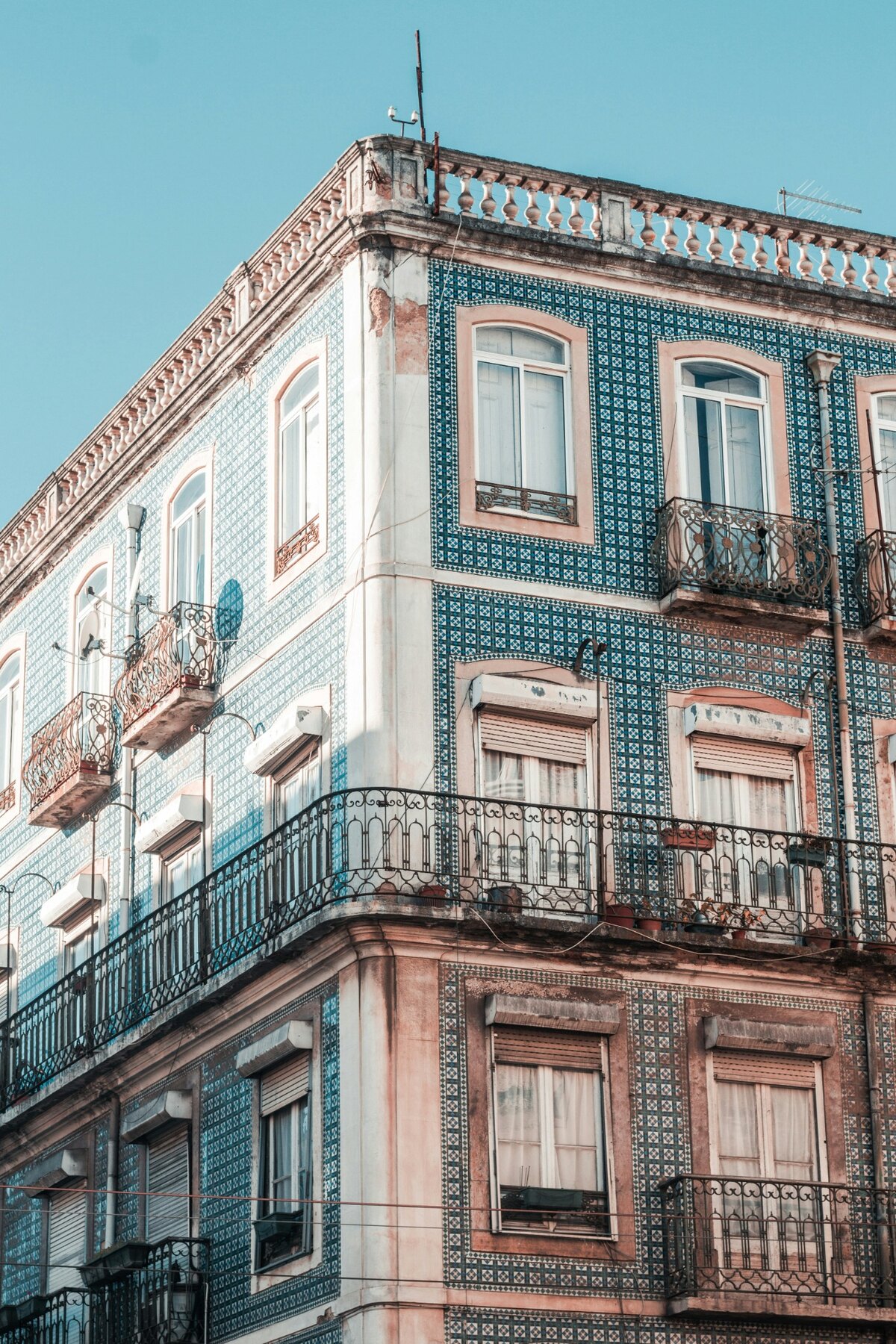 Blue-and-white tiled façade and wrought-iron balconies in Lisbon