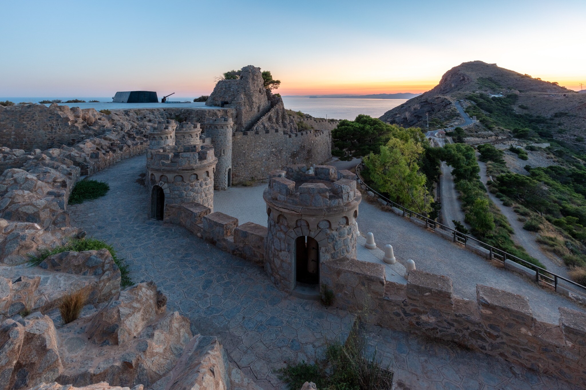 The stone towers of Batería de Castillitos above the Mediterranean