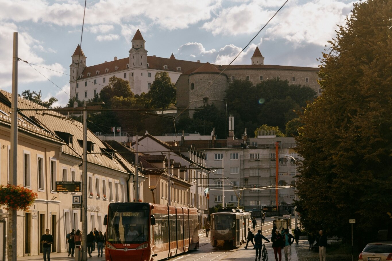A tram approaching Bratislava Castle below the hillside