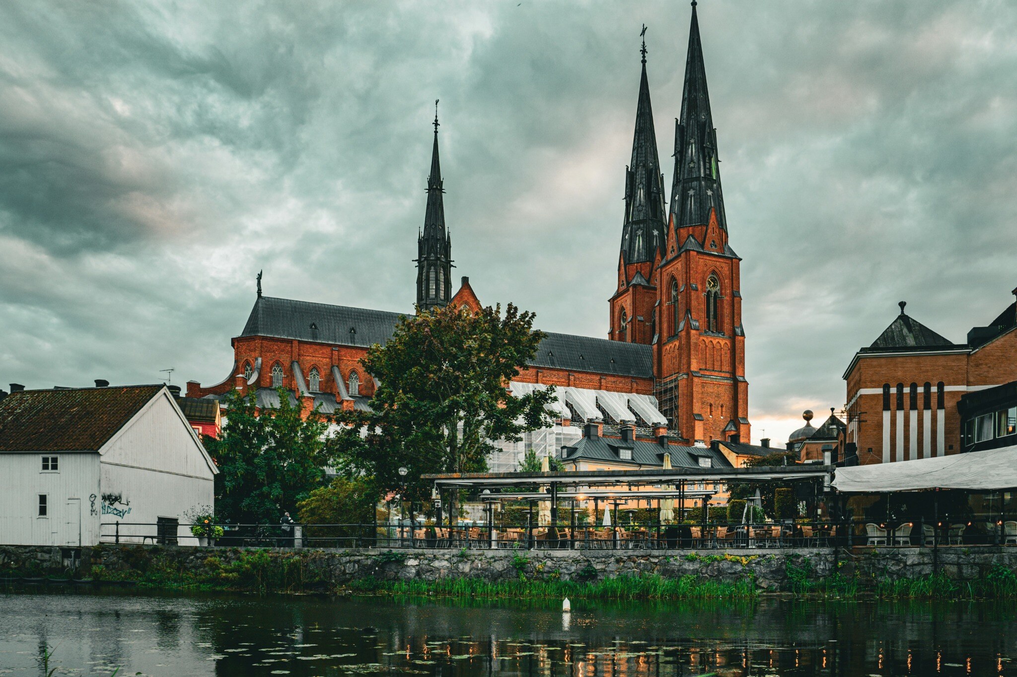The twin spires of Uppsala Cathedral above the riverside