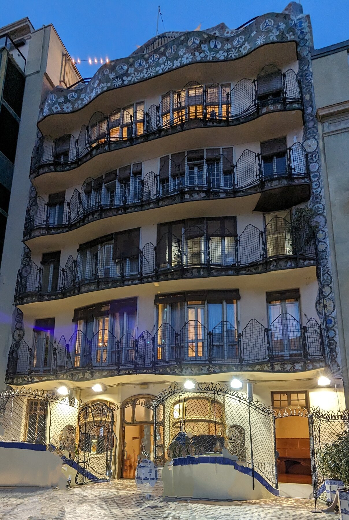 The curved façade and balconies of a Modernisme apartment building in Barcelona